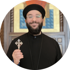 priest holding a cross